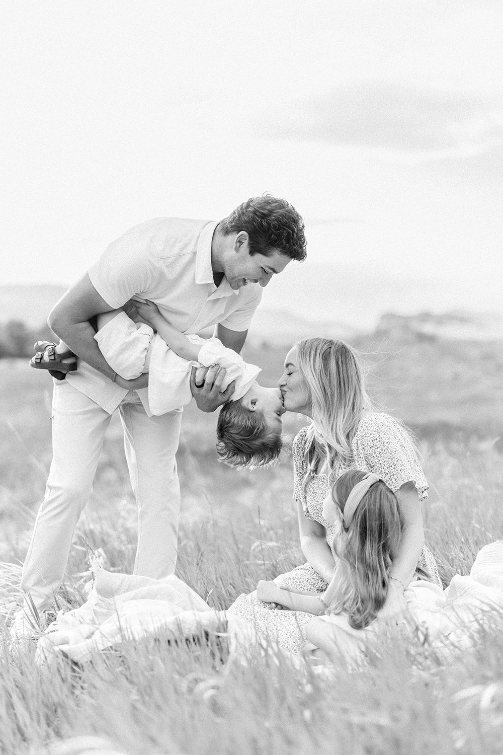 Family playing together during an outdoor portrait session in the Colorado foothills