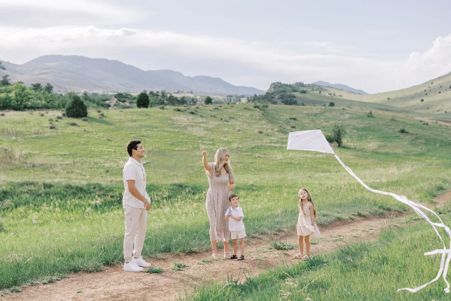 Denver family flying a kite in the foothills of Colorado