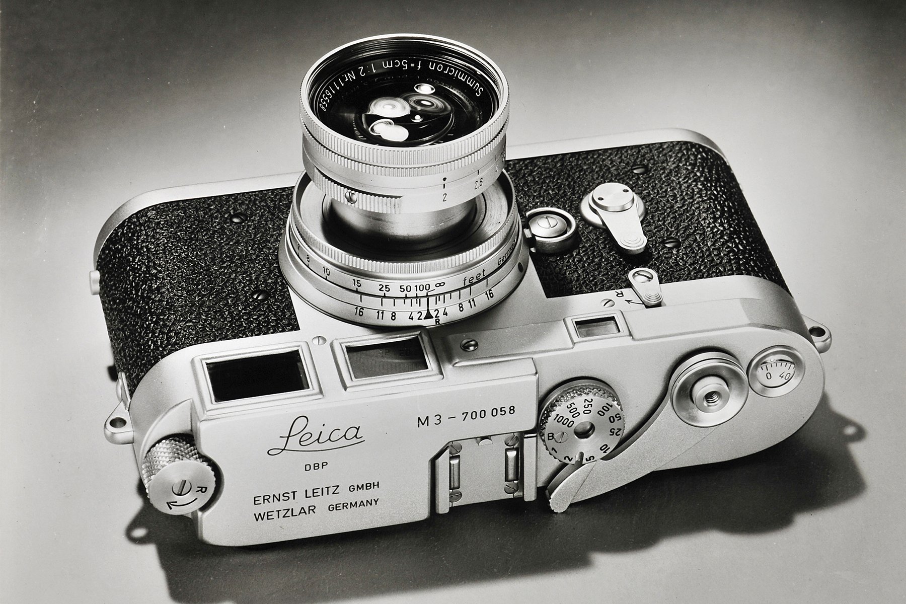 Very early Leica M3 No. 700058 with collapsible 50mm f2 Summicron. Note angular contour of rounded section of right-hand end of top cover. .jpg