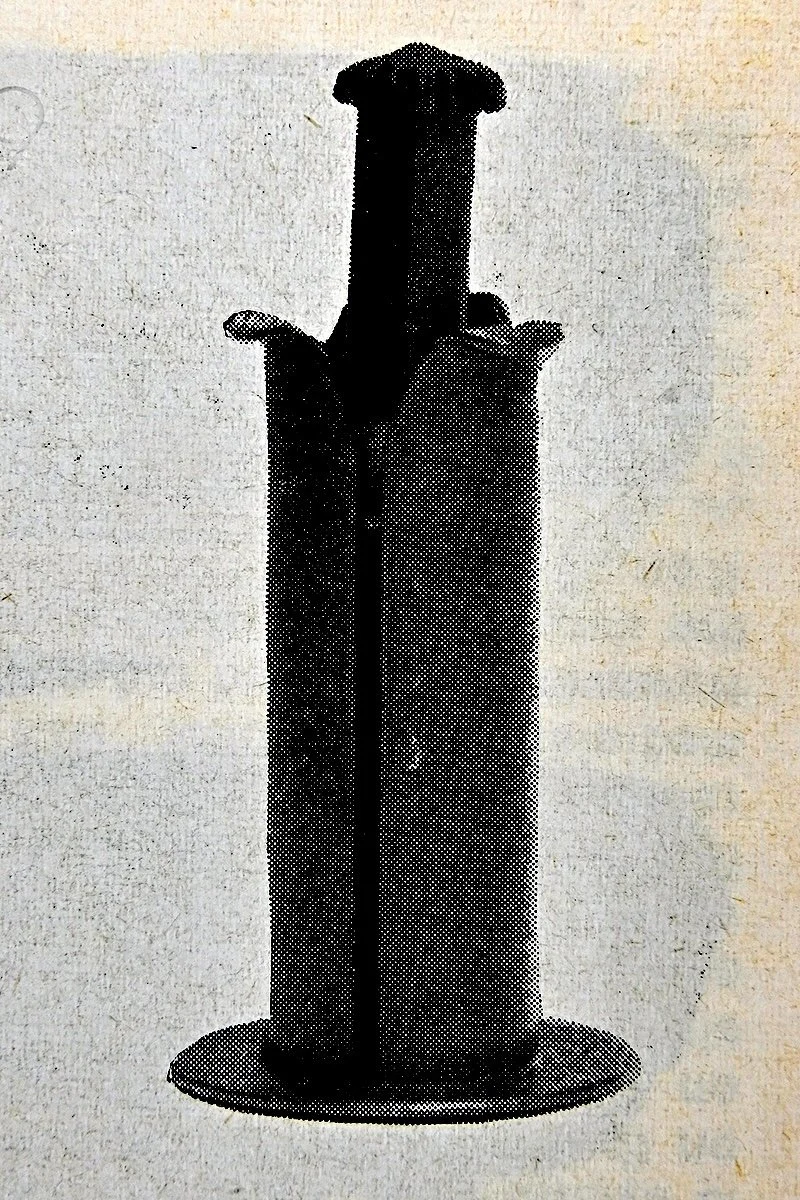 The distinctive removable quick-load take-up spool used in the Leica M5..JPG