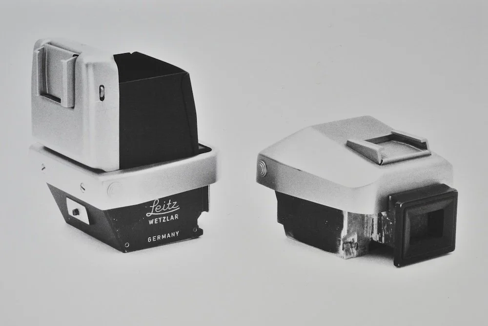 Interchangeable waist-level finder and plain prism unit for prototype Leicaflex. Note cold shoe on each unit .JPG