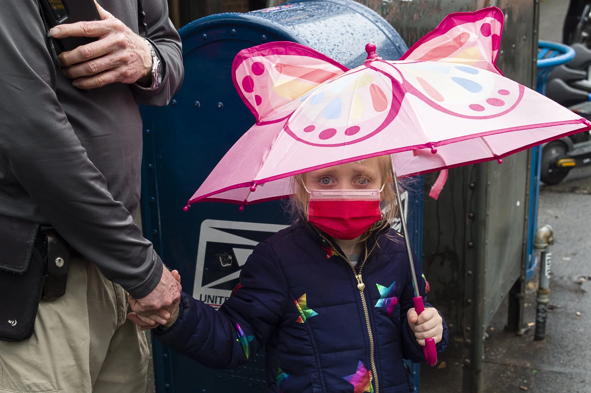 Girl in pink holding hands.jpg