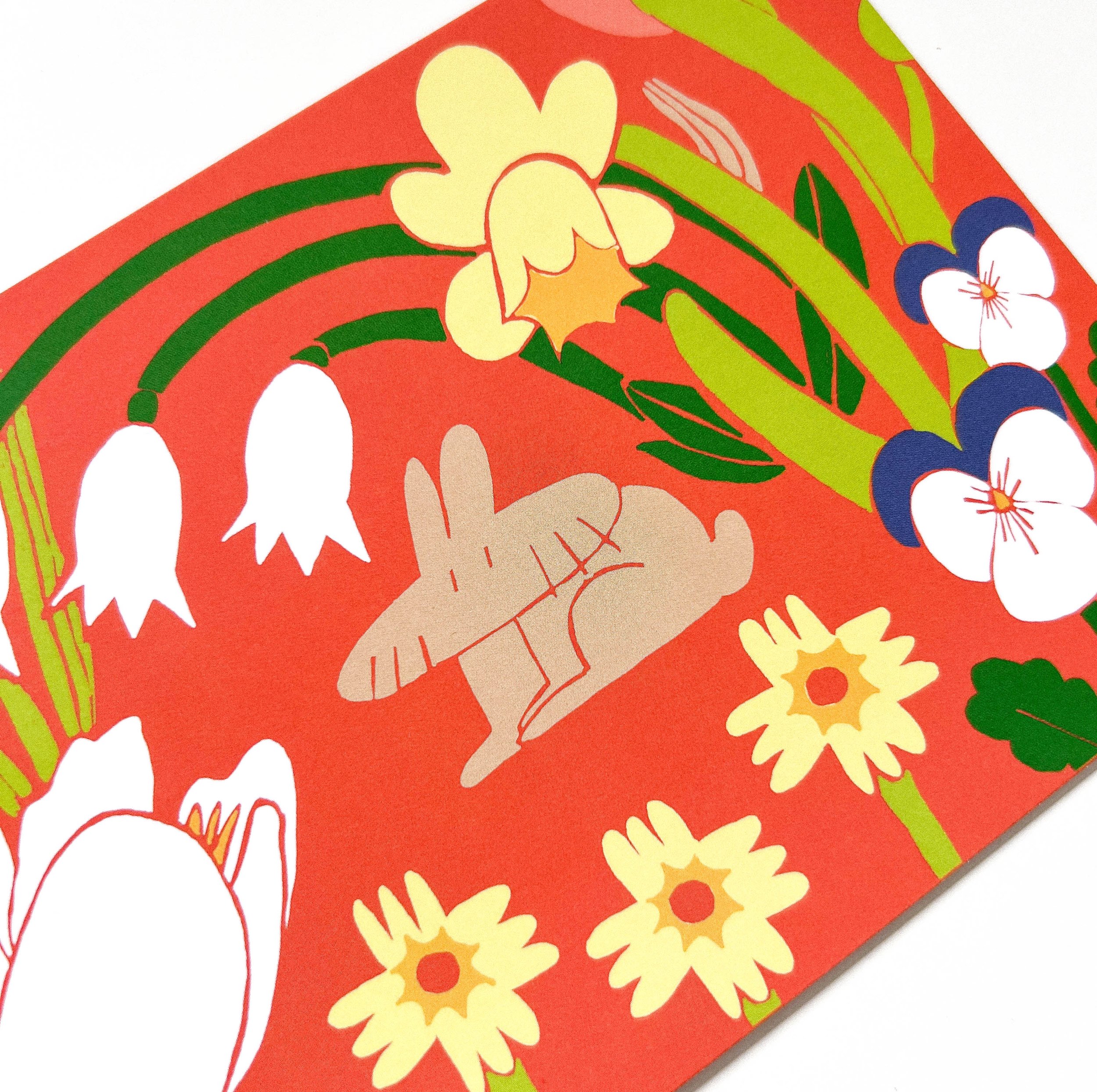 Single A6 card from “The Blooming Spring Realm” bundle with a warm red background. A brown rabbit is surrounded by blooming spring flowers in a vibrant, poetic composition.