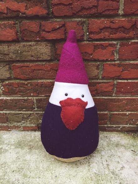 Rusty the gnome pillow made from reclaimed textiles.