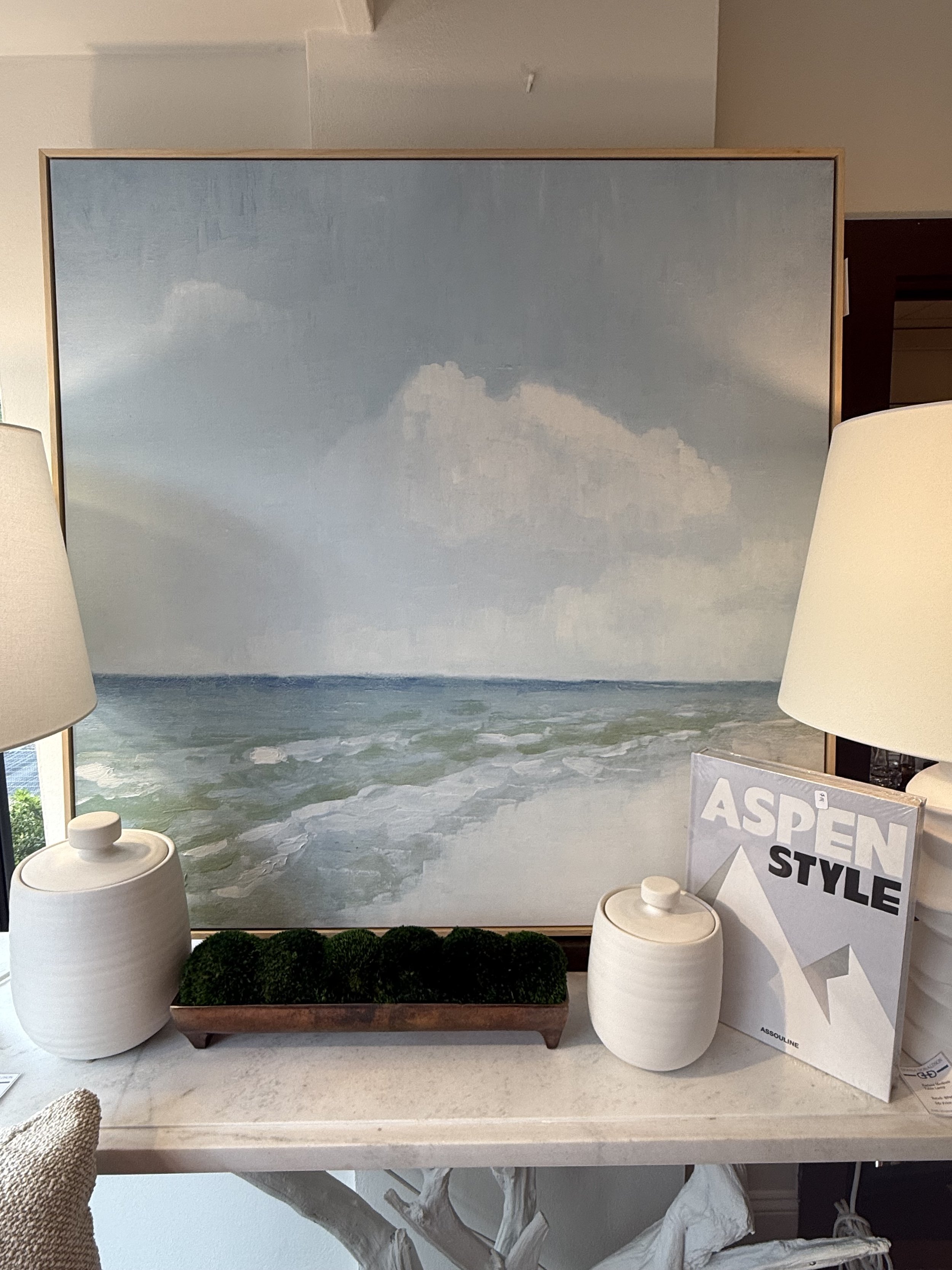 “Lazy Days” framed 40x40 seascape artwork featuring soft ocean waves and cloudy sky in muted blues and greens, available at Donna Donaldson Interiors.