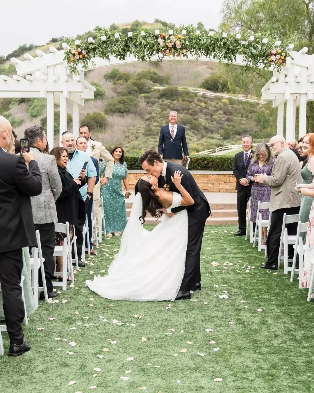 The aisle kiss executed to perfection&nbsp;
@triniiii____ @robertmiyoshi
.
.
.
Venue: @blackgoldgolfclubevents
Florist: @bellarueeventsandflorals
DJ/Entertainment: @carcanodj
Makeup: @quintanillakathie
Cake: @pattys.cakes
Wedding Dress: @janaanncoutu