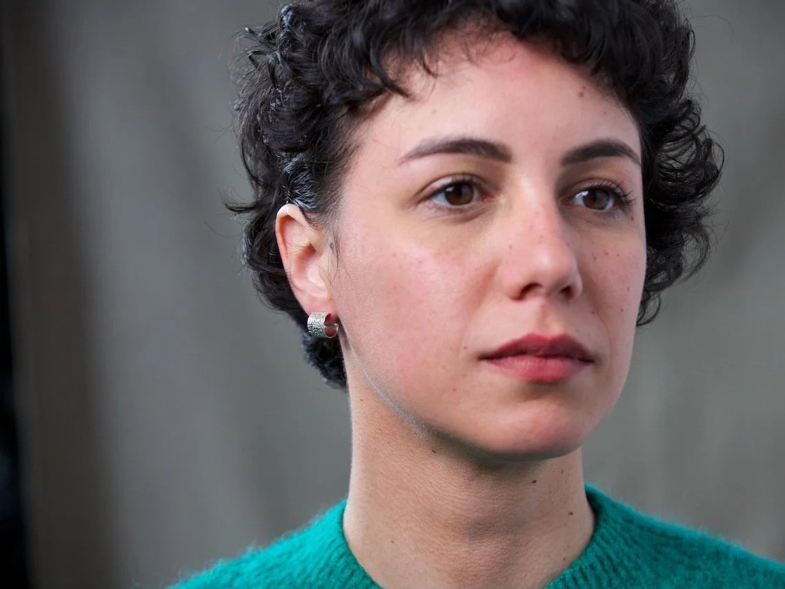 close-up-of-models-face-focusing-on-the-right-ear-wearing-small-stamped-textured-hoop-earrings.jpg