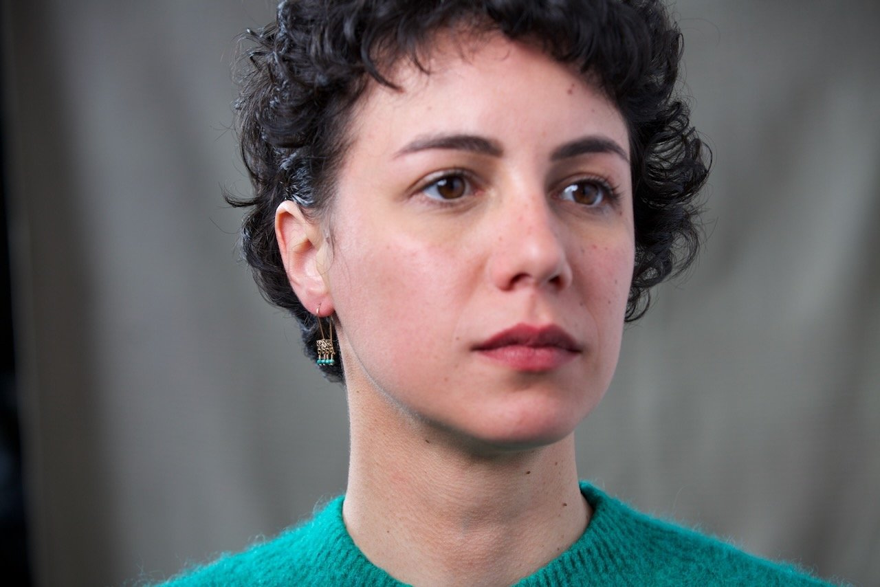 front-left-shot-of-models-right-ear-waering-gold-earring-with-turquoise-beads.jpeg