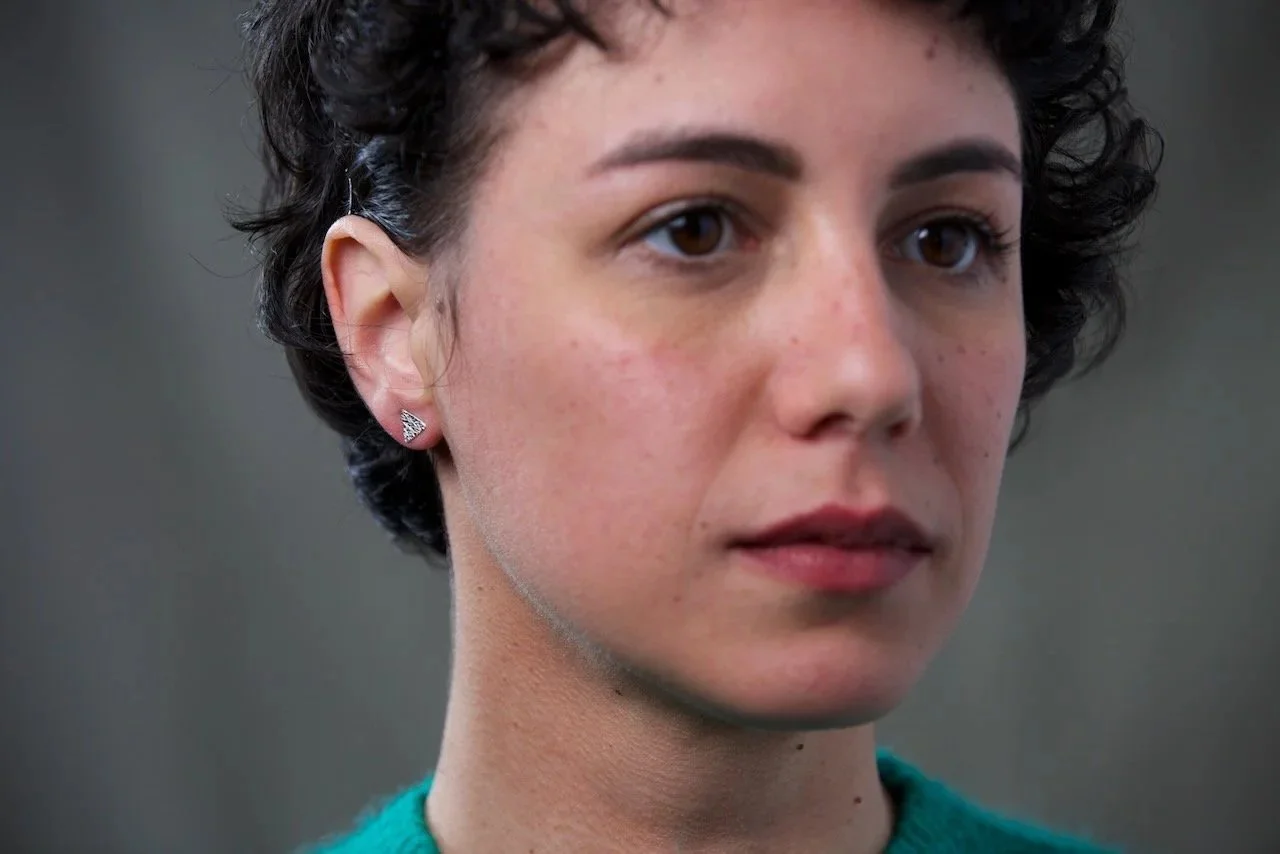 model-wearing-silver-triangle-stud-earrings.jpg