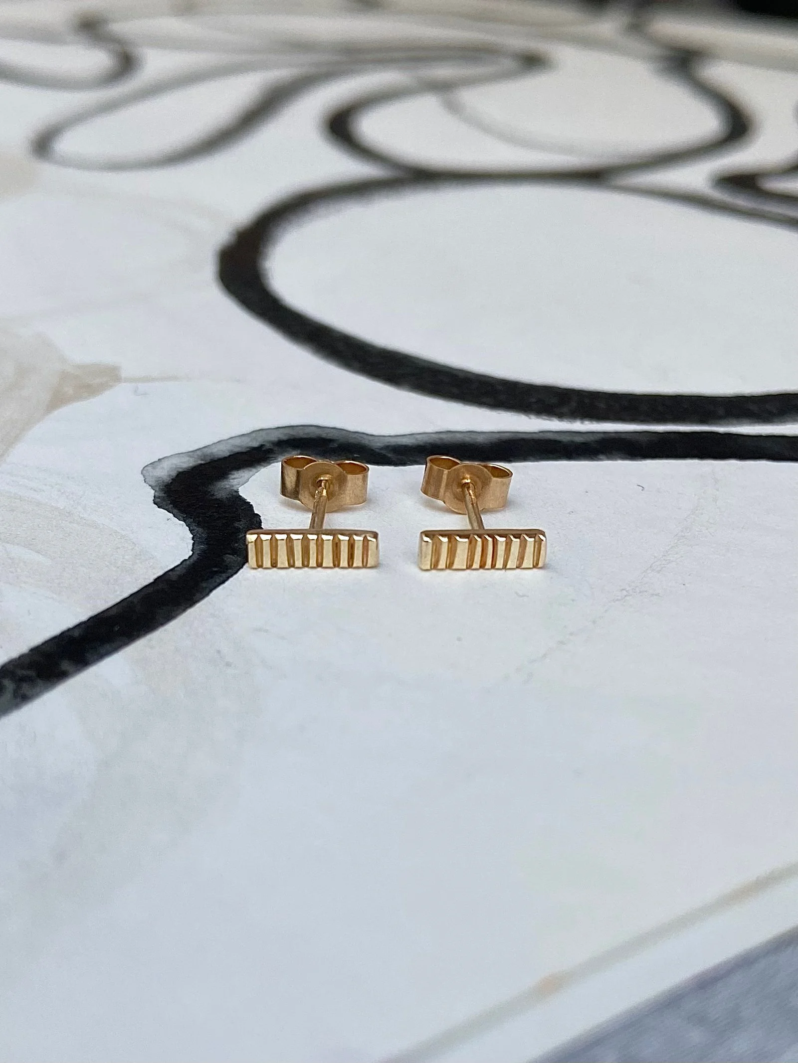 Long line stamped studs, 9ct Gold.