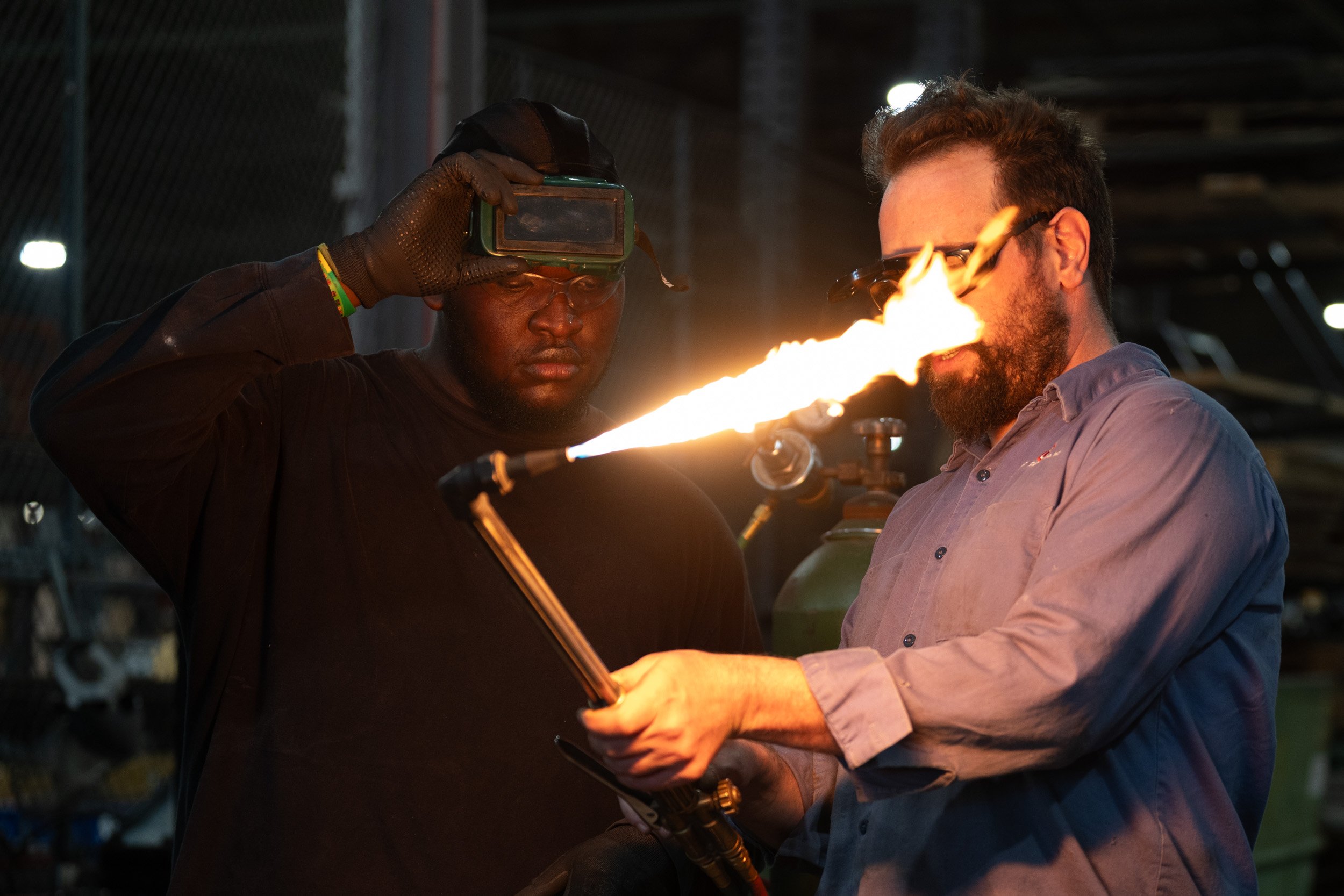 David Graeser mentors Daniel Ogunrinde while welding materials at Plastic Recycling Inc., on July 14, 2026. Ogunrinde his an intern through 16 Tech, where the program gives housing allowance, and mental health support. 