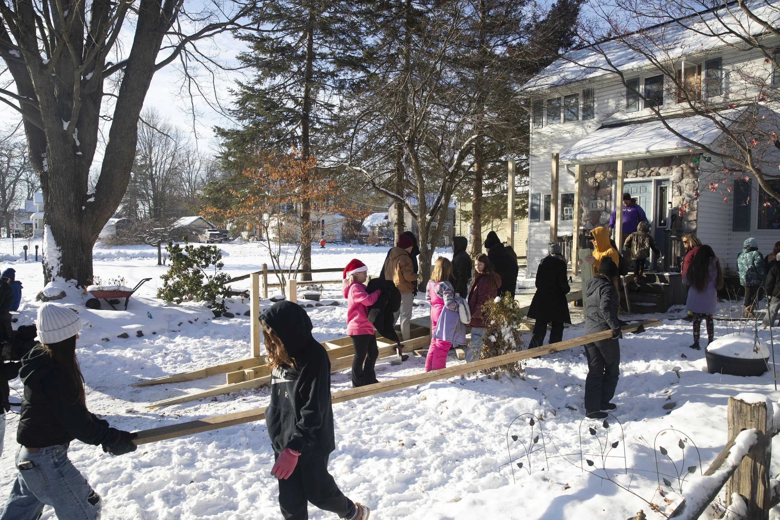 Concord Middle School students work on building a ramp for a student's father who became disabled after a crash a year ago. Mike Arbuckle, an industrial arts teacher at Concord Middle School lead the project and installment outside of the home on S. 