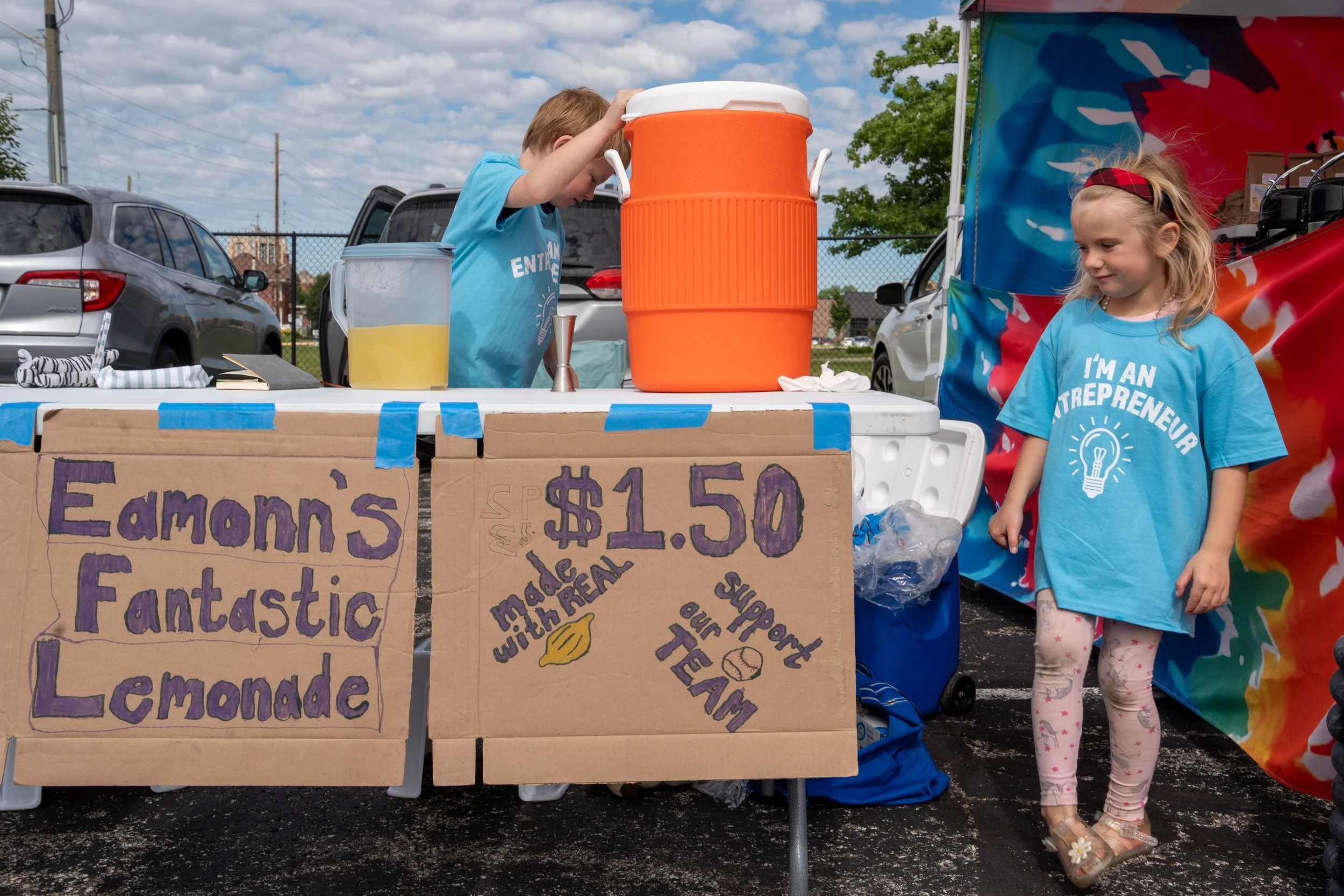 Eamonn Goodman, 7, sets up his lemonade stand with Nora Goodman, 5, at a Kids Markets on June 16, 2026 in Beech Grove.  Kids are able to create and sell their own products at local farmers markets. 