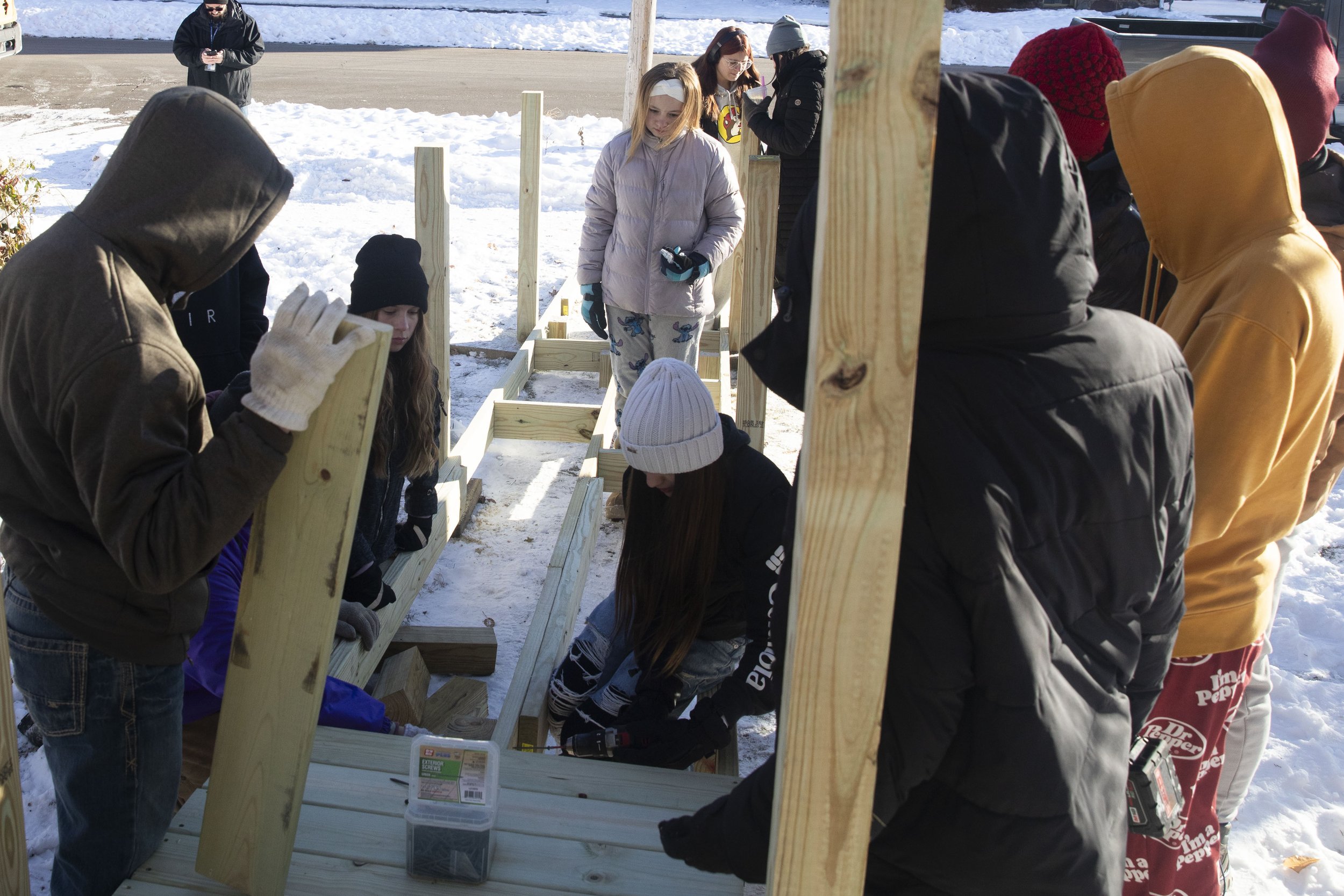 Concord Middle School students work on building a ramp for a student's father who became disabled after a crash a year ago. Mike Arbuckle, an industrial arts teacher at Concord Middle School lead the project and installment outside of the home on S. 
