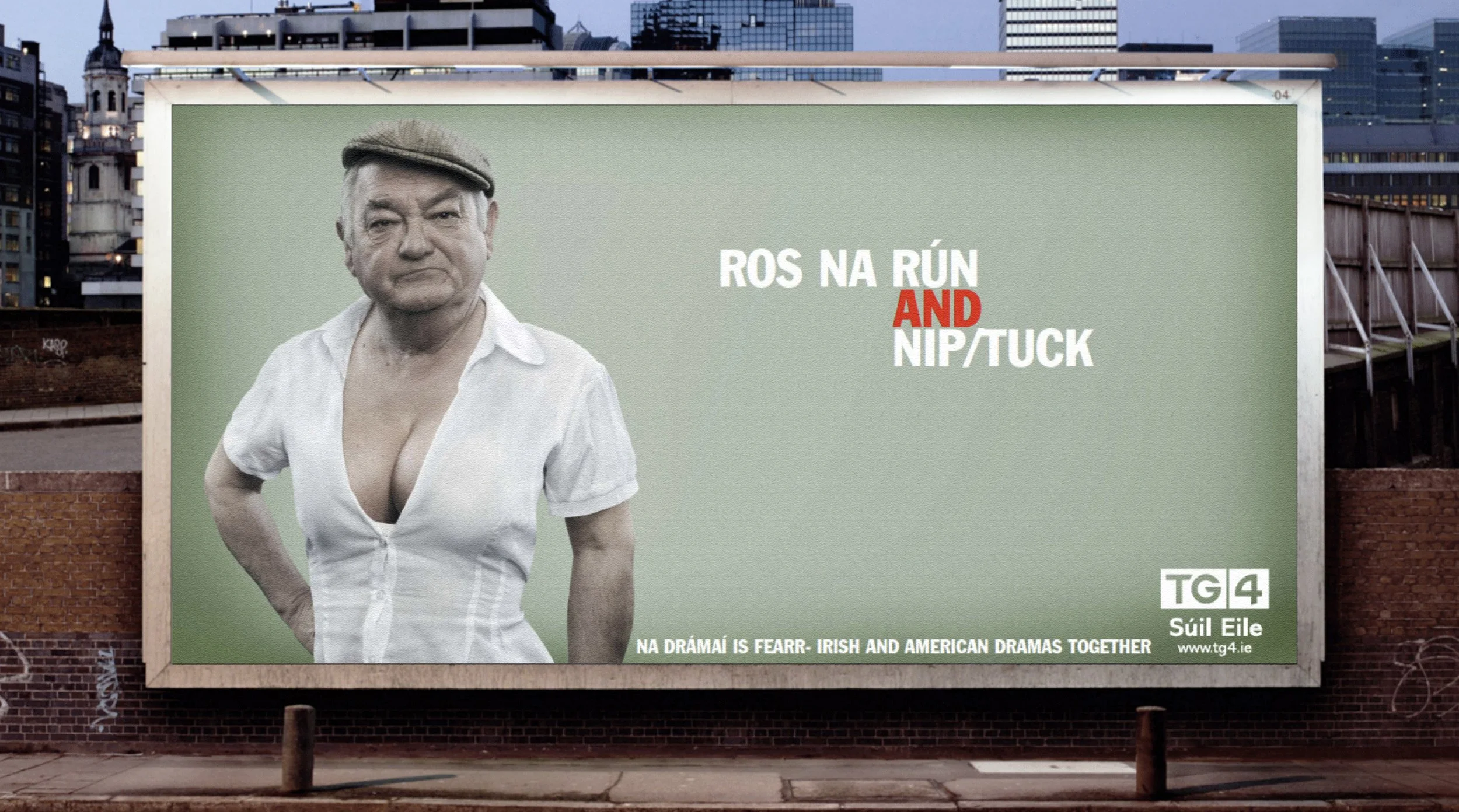 Billboard on a city street advertising a show called "Ros na Rún and Nip/Tuck," featuring an older man with a serious expression wearing a hat and a low-cut white shirt. The billboard includes the TG4 logo and Irish text at the bottom.