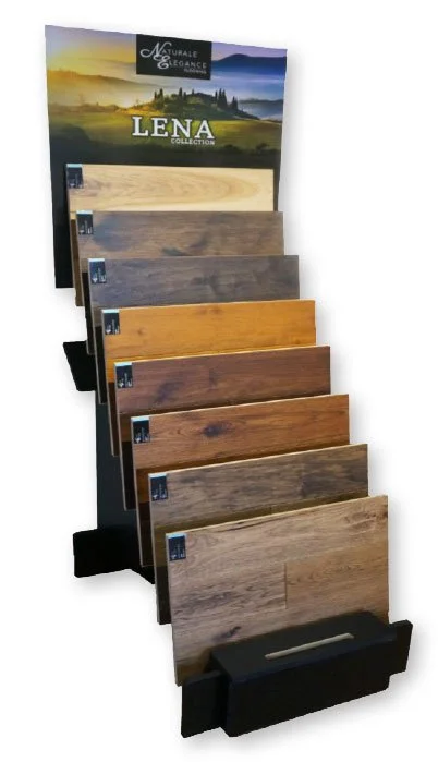 Display stand showcasing various wood flooring samples in different shades and finishes with a sign reading "LENA Collection."