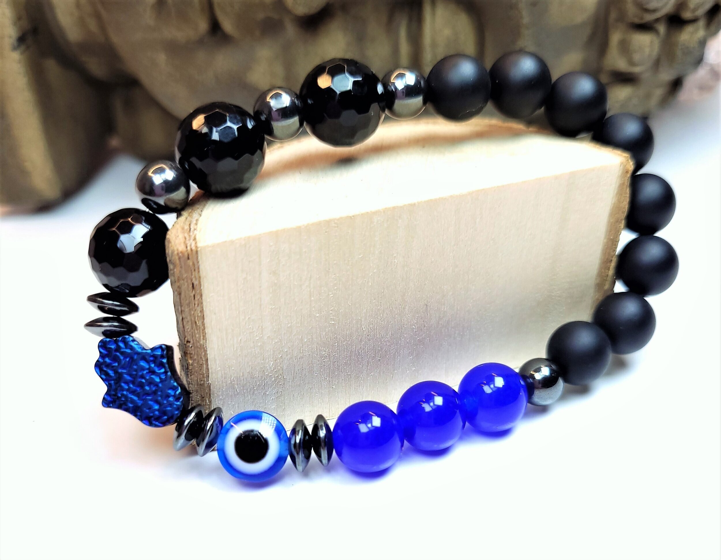 evil+eye+blue+hamsa+evil+eye+10mm+facet+black+onyx.jpg
