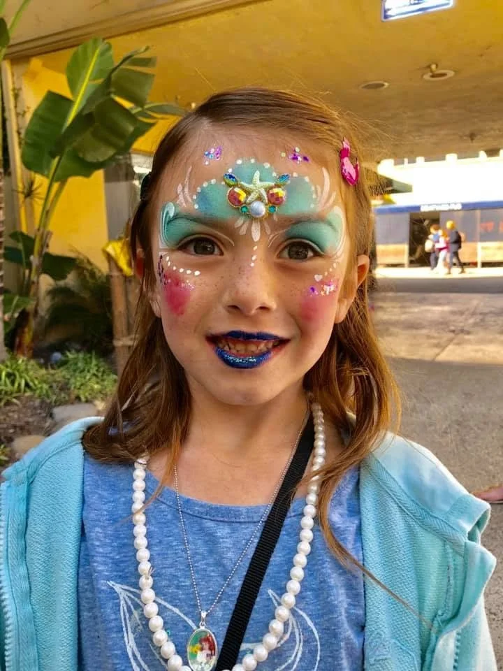 Happy Rainbow Artistic Face Painting by Lucia Elmore