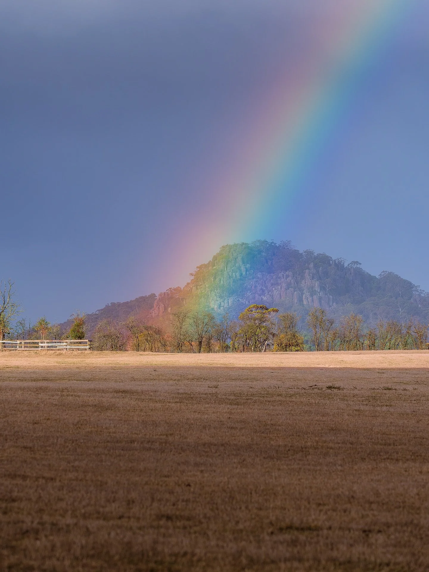 It&rsquo;s been awhile since I caught a rainbow, so I was happy to catch this one in front of Hanging Rock today 🌈