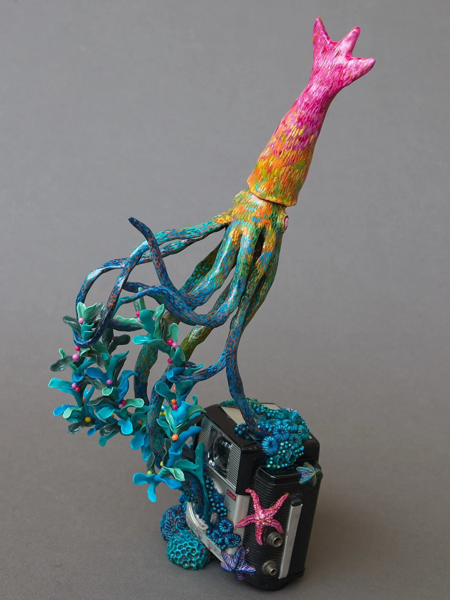 Festive Squid, Miniature Squid Sculpture on Vintage Kodak Camera, 2026, Stephanie Kilgast