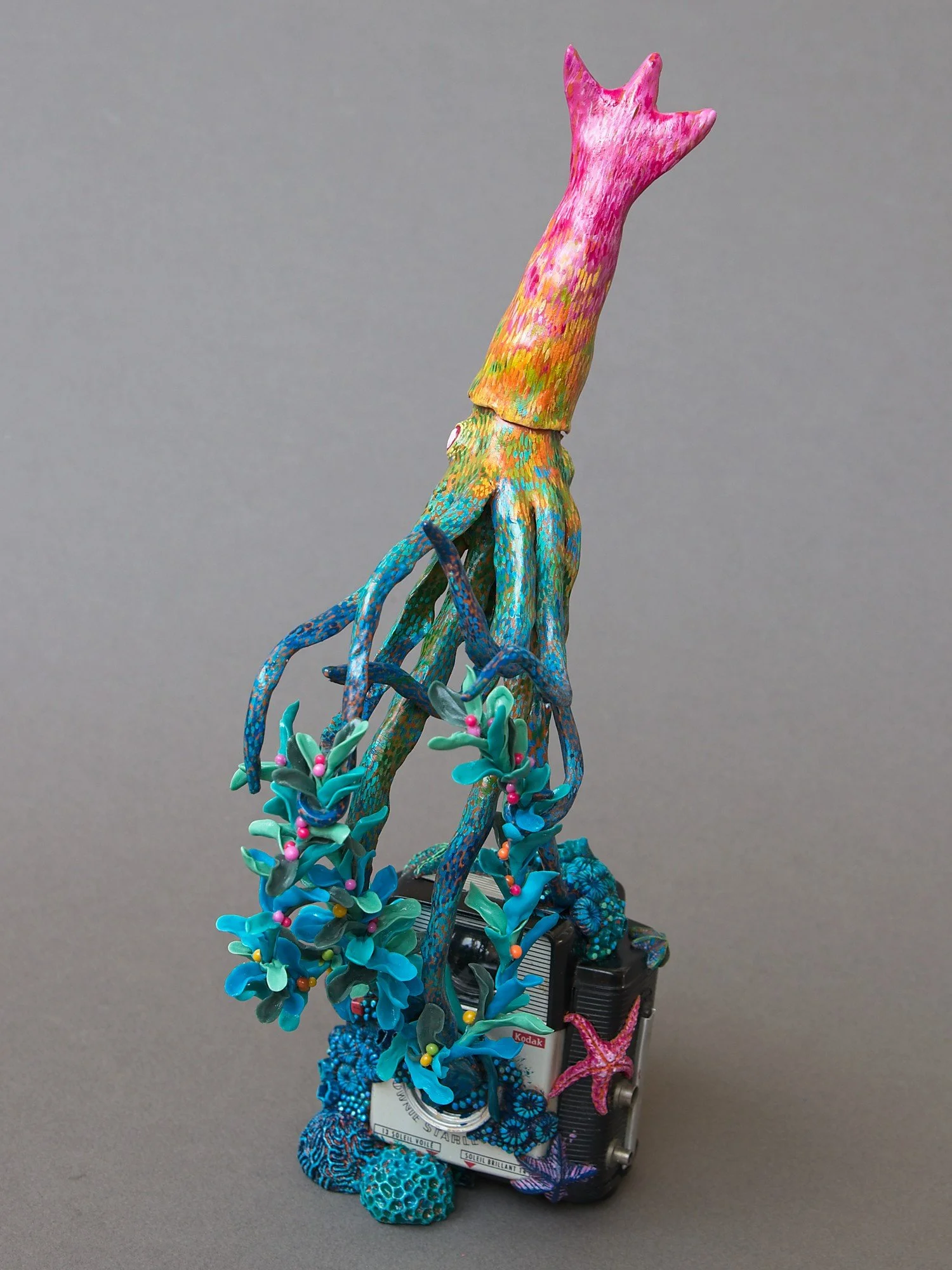 Festive Squid, Miniature Squid Sculpture on Vintage Kodak Camera, 2026, Stephanie Kilgast