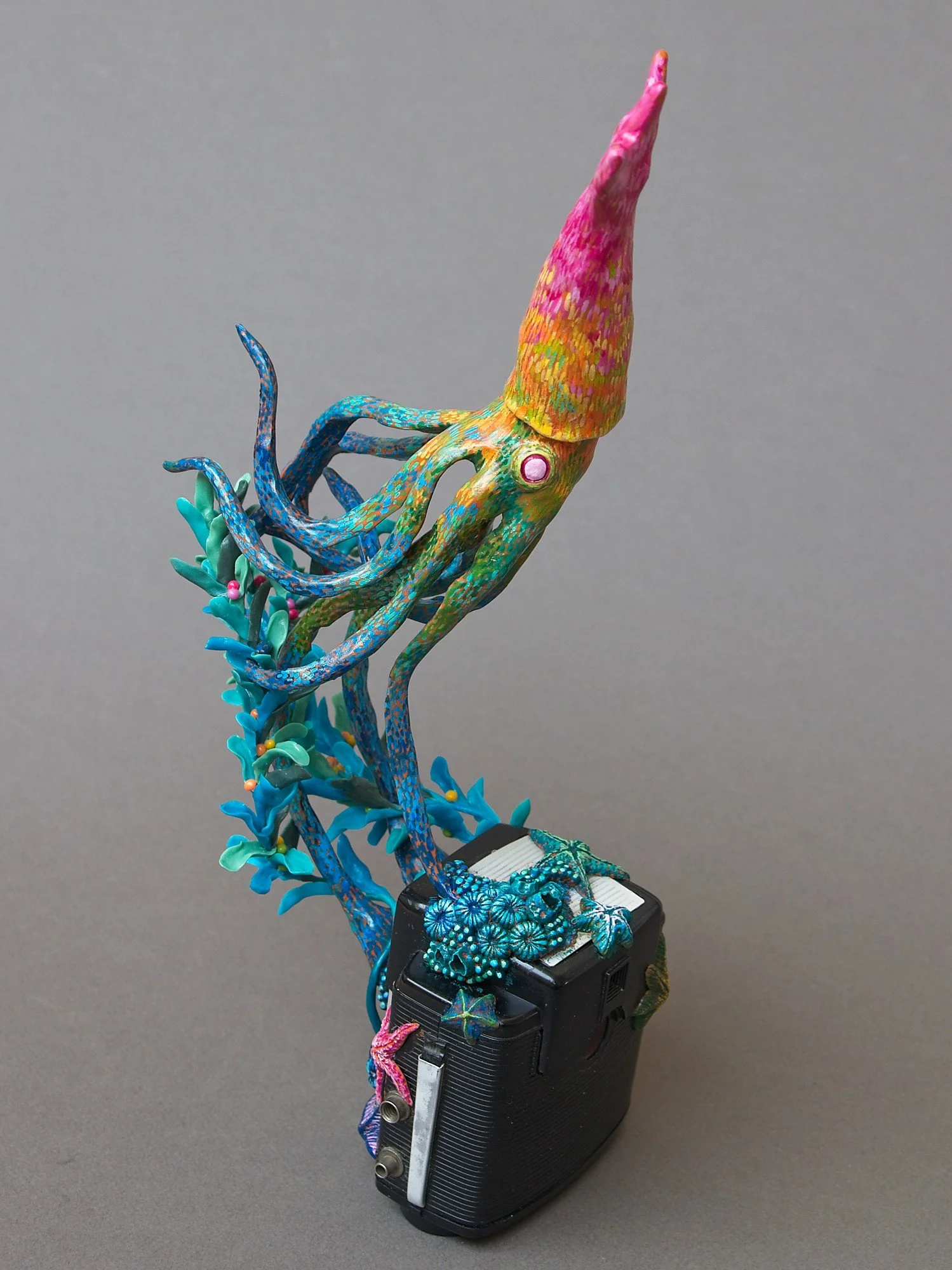 Festive Squid, Miniature Squid Sculpture on Vintage Kodak Camera, 2026, Stephanie Kilgast