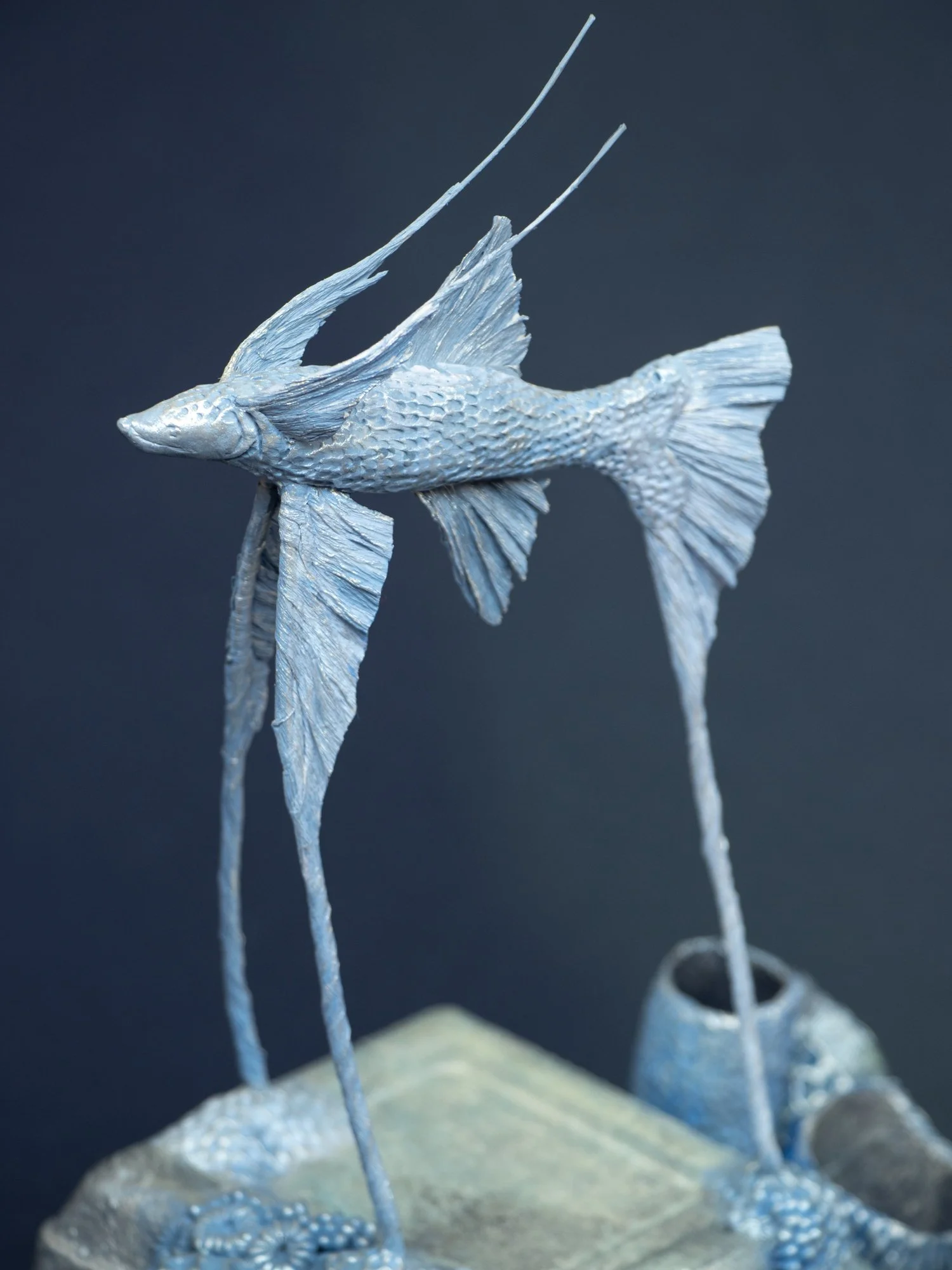 Precarious Balance, Mixed Media Coral and Tripod Fish Sculpture on Trash, 2026, Stephanie Kilgast