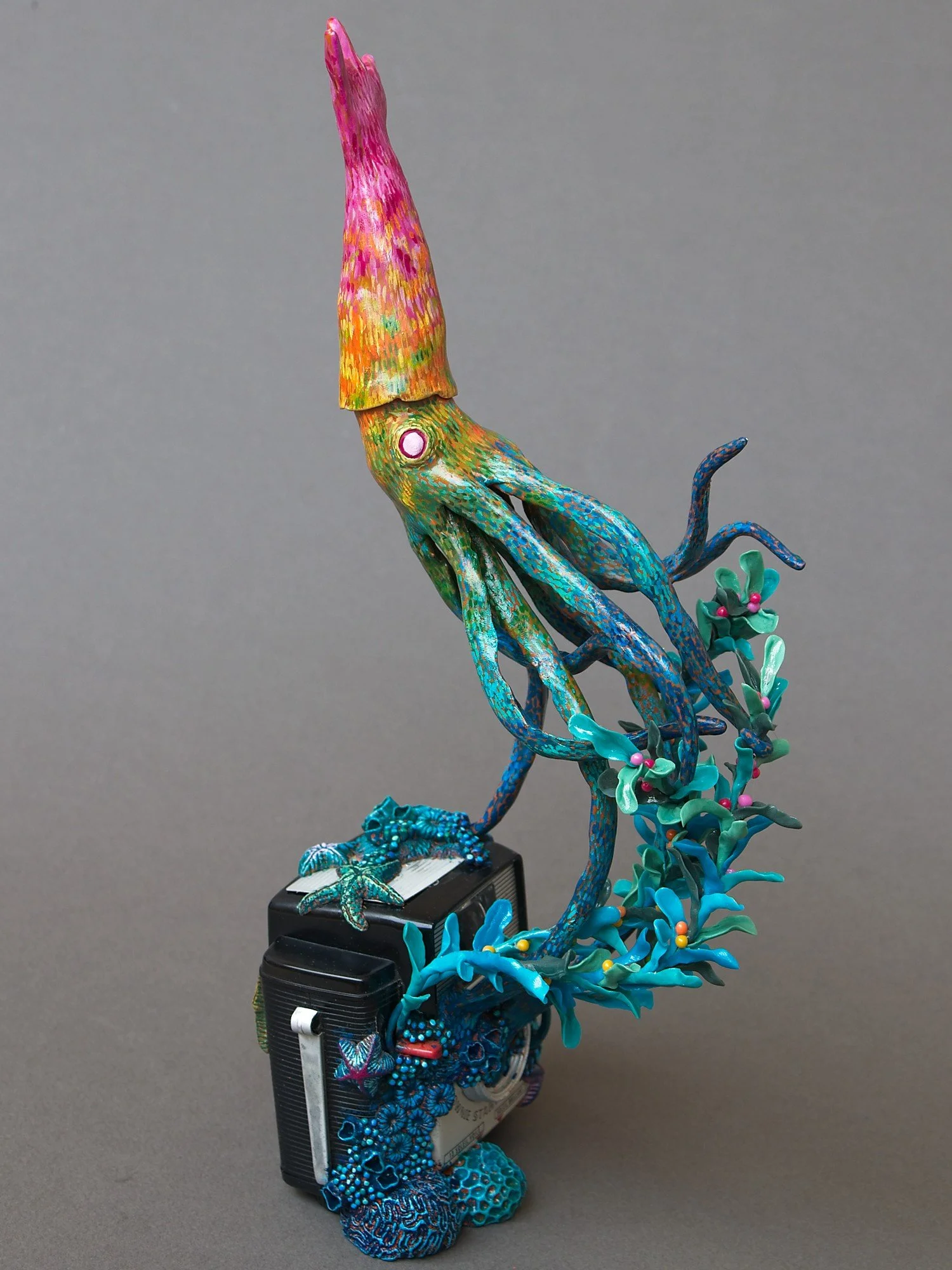 Festive Squid, Miniature Squid Sculpture on Vintage Kodak Camera, 2026, Stephanie Kilgast
