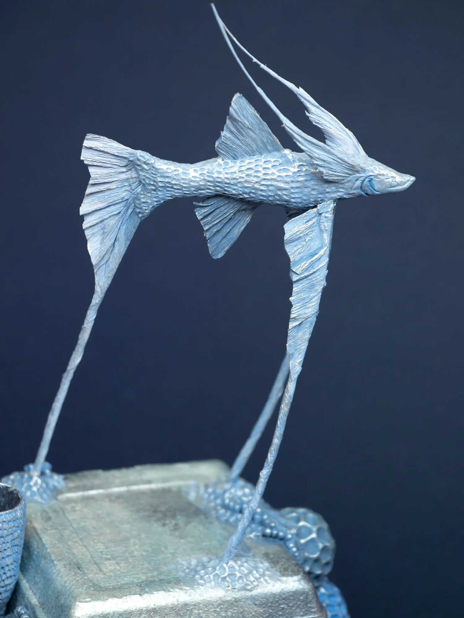 Precarious Balance, Mixed Media Coral and Tripod Fish Sculpture on Trash, 2026, Stephanie Kilgast