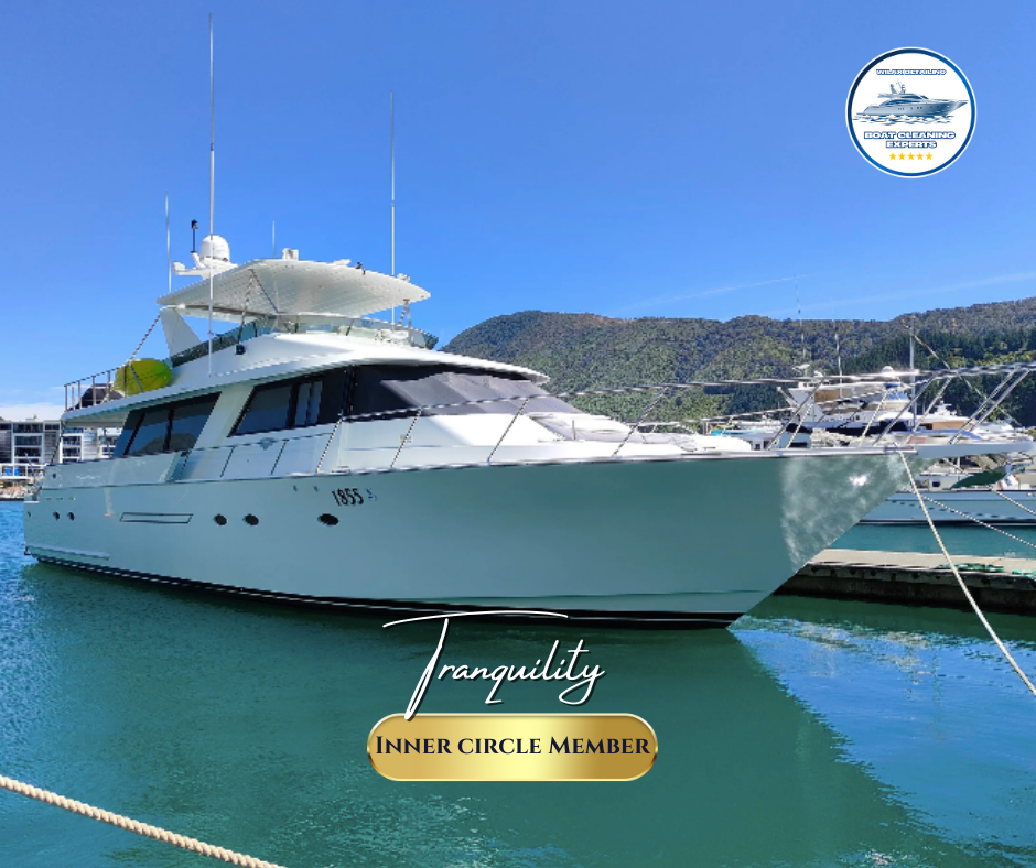 Luxury yacht docked at marina with blue sky