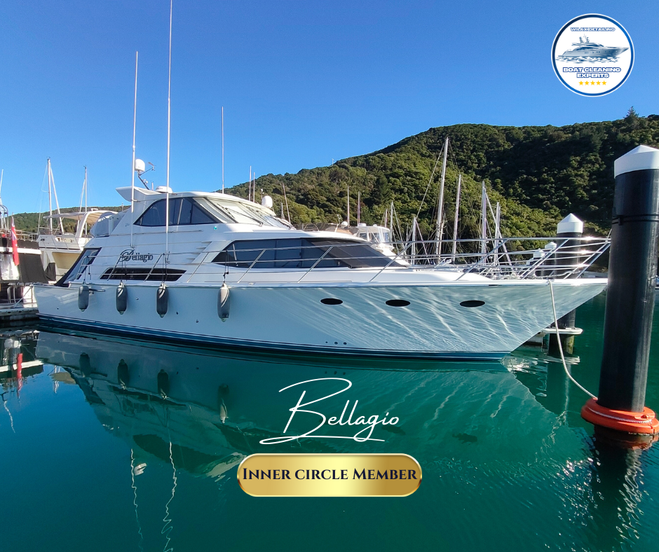 Luxury yacht named Bellagio docked at a marina with blue sky in the background.