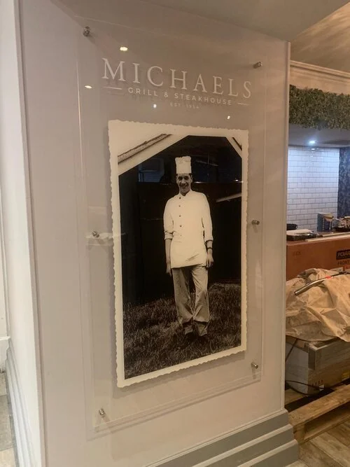 Clear indoor sign with stud fixings