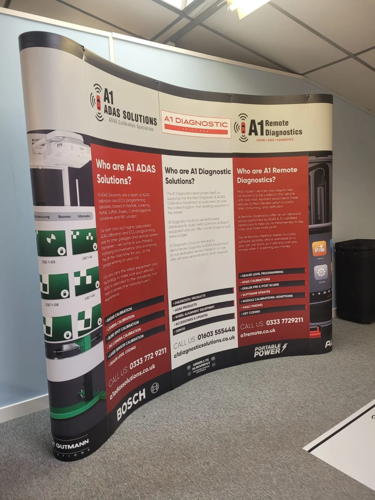 red, black and white curved pop up exhibition banner