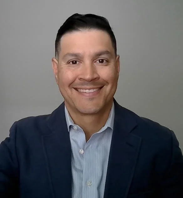 headshot of male is a suit