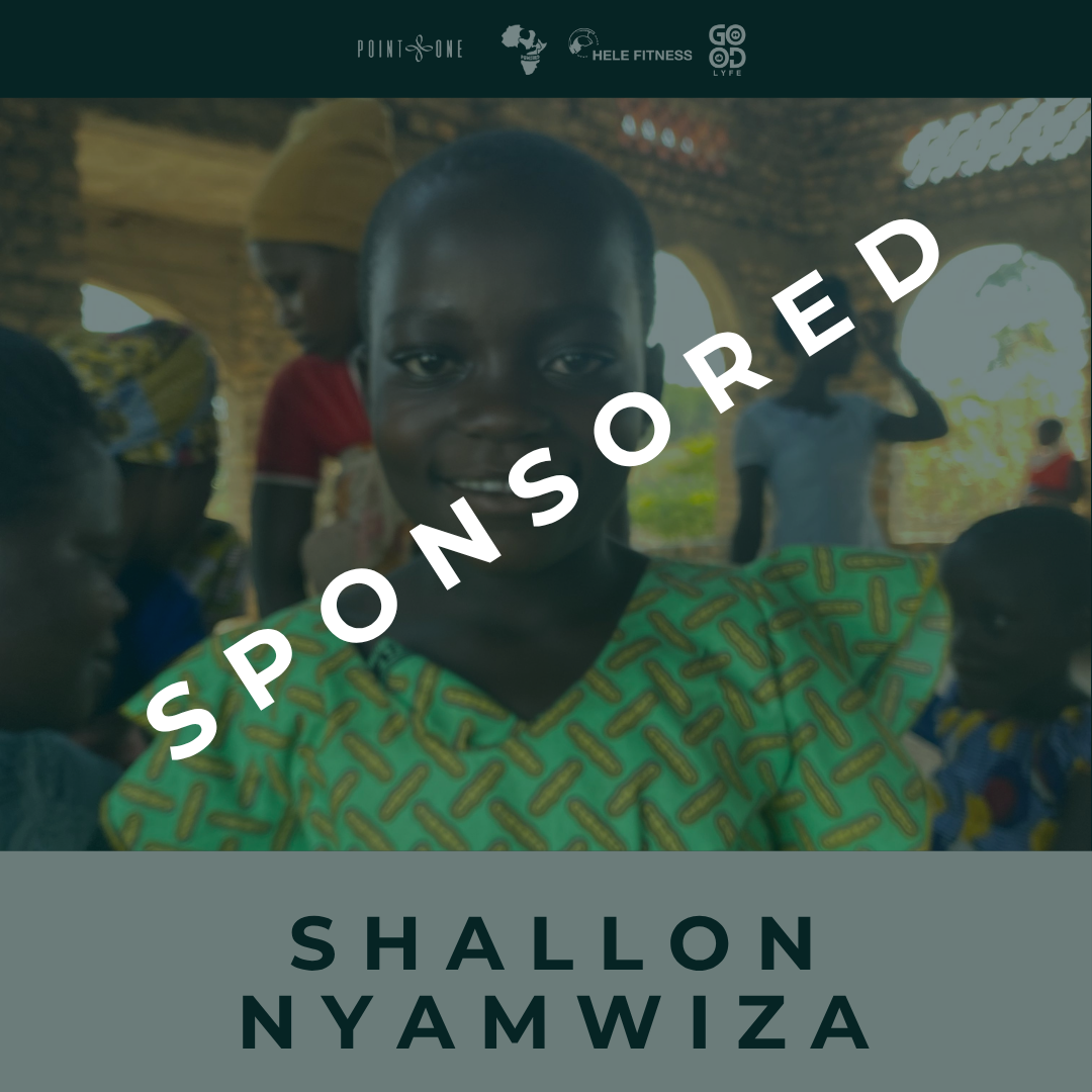 A smiling young woman in colorful clothing inside a building with other people in the background with the word "SPONSORED" across the photo diagonally. 