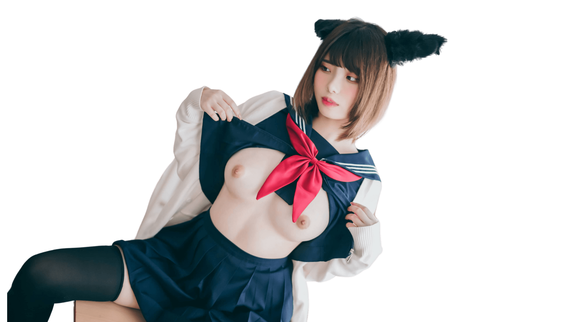 Person wearing a navy blue and red sailor-style outfit with a white jacket, featuring cat ears on their head.