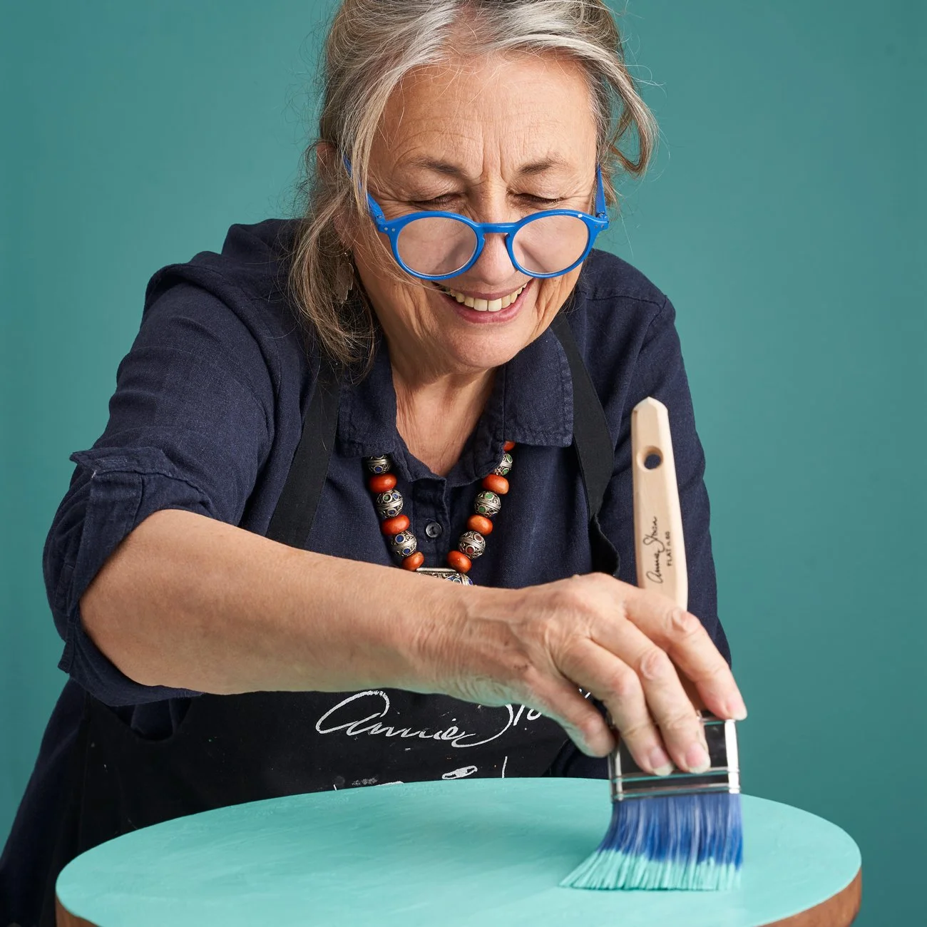 Annie-Sloan-using-Chalk-Paint-furniture-paint-in-a-mix-of-Florence-and-OId-White-to-paint-a-table-using-a-Flat-Brush-1300 copy.jpg