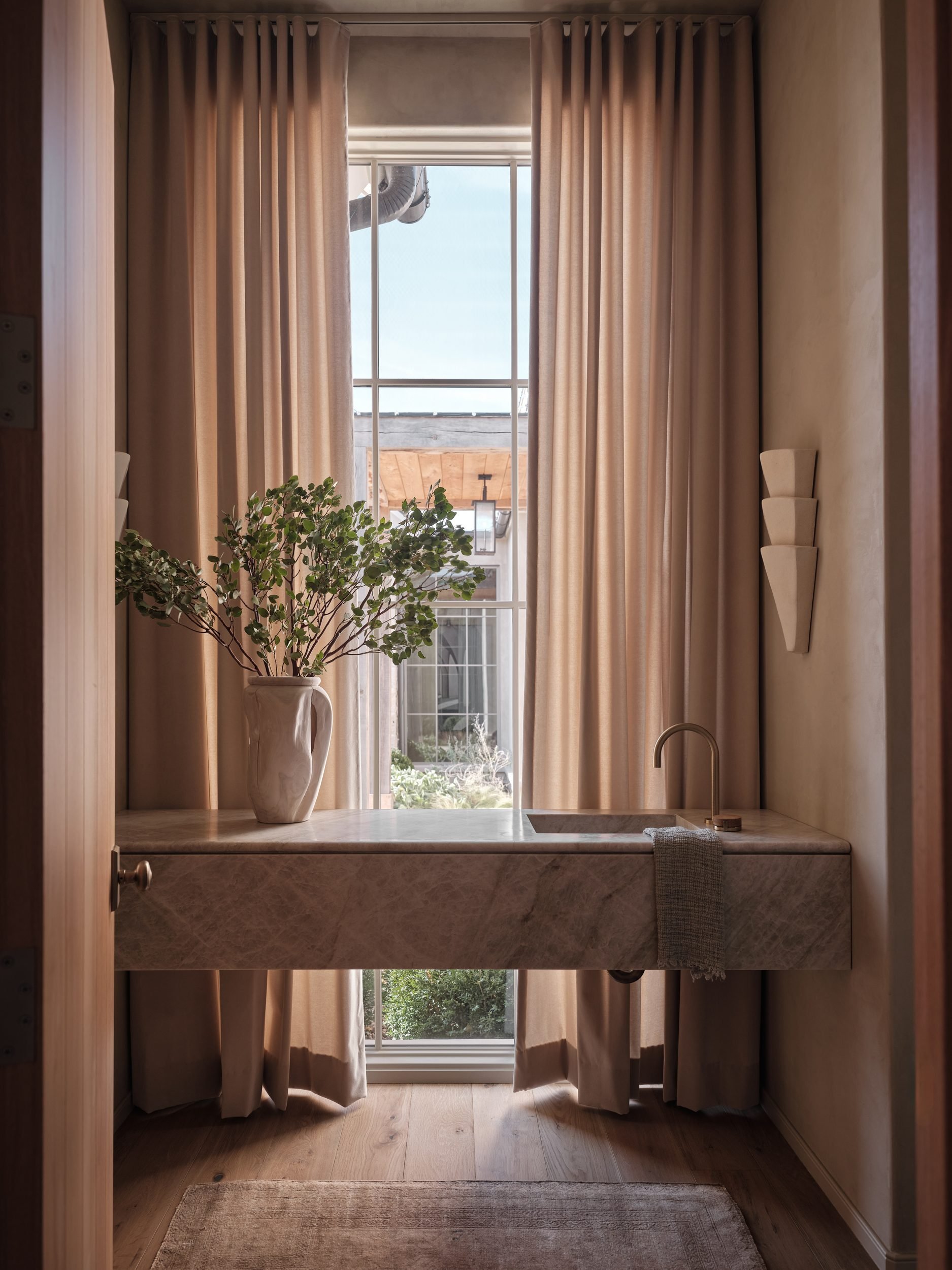 april-tomlin-interiors-compelling-restraint-powder-room-stone-vanity.jpg