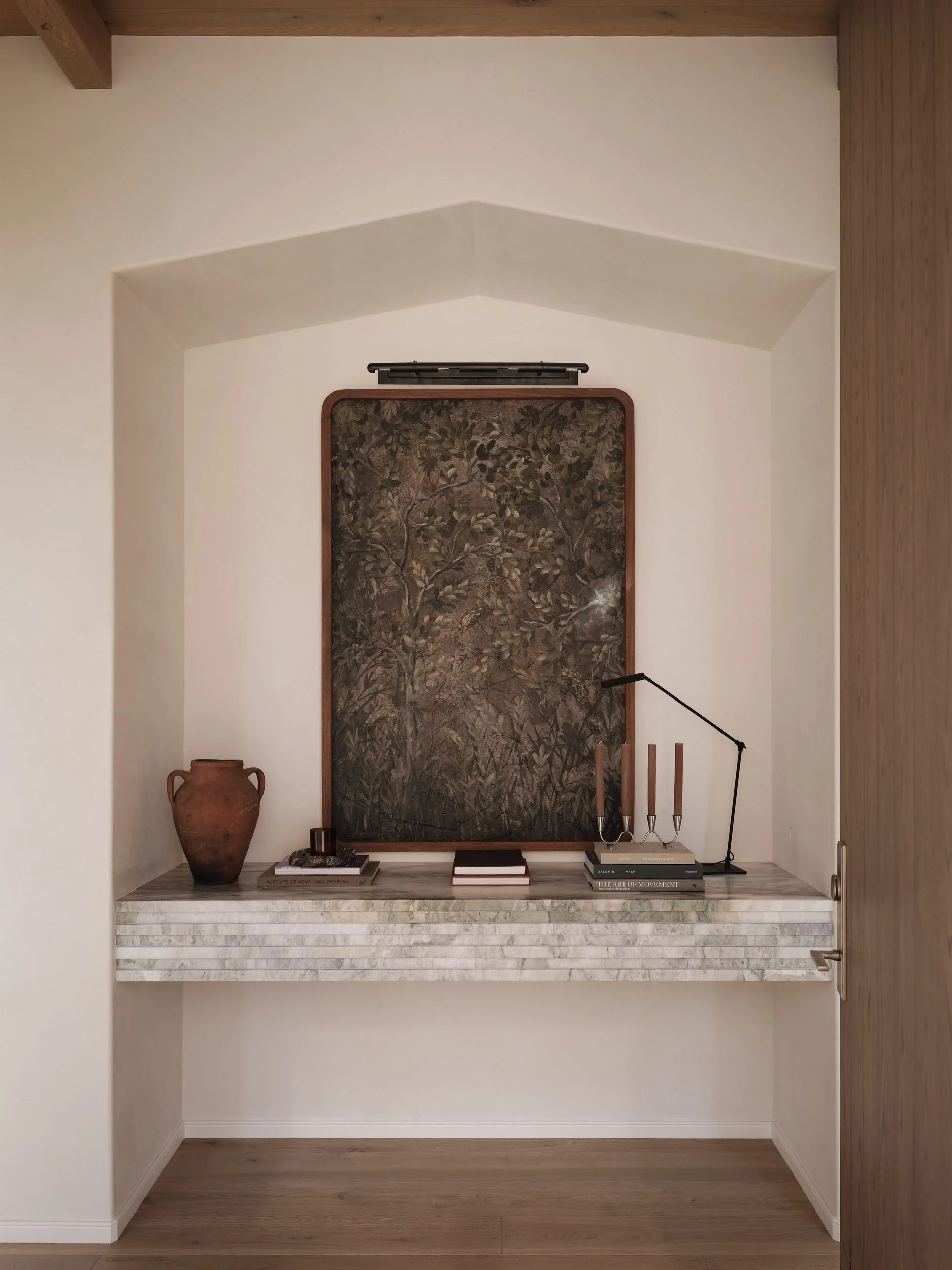 april-tomlin-interiors-compelling-restraint-hallway-niche-stone-console.jpg