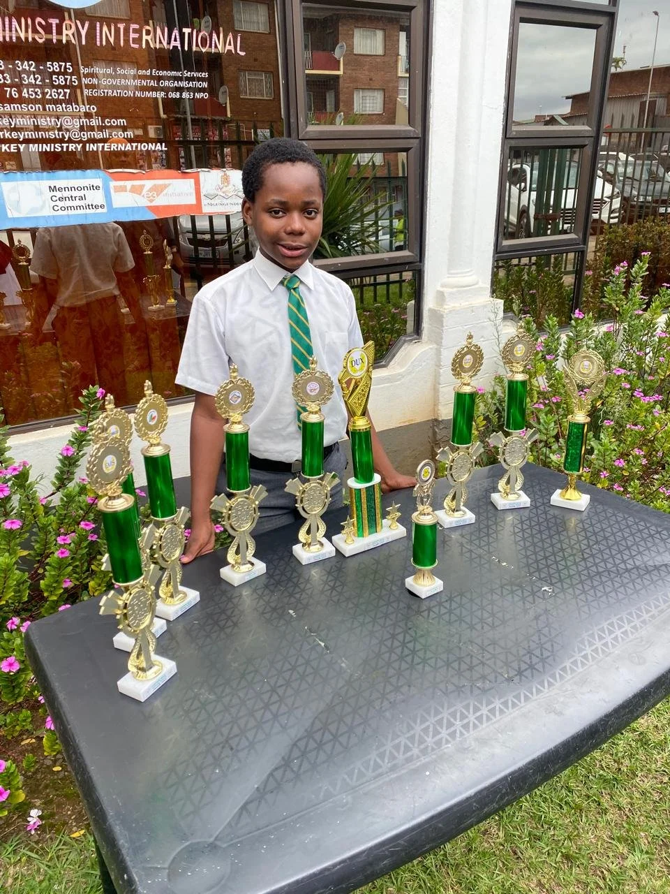 The boy from this story with all the school trophies he has won