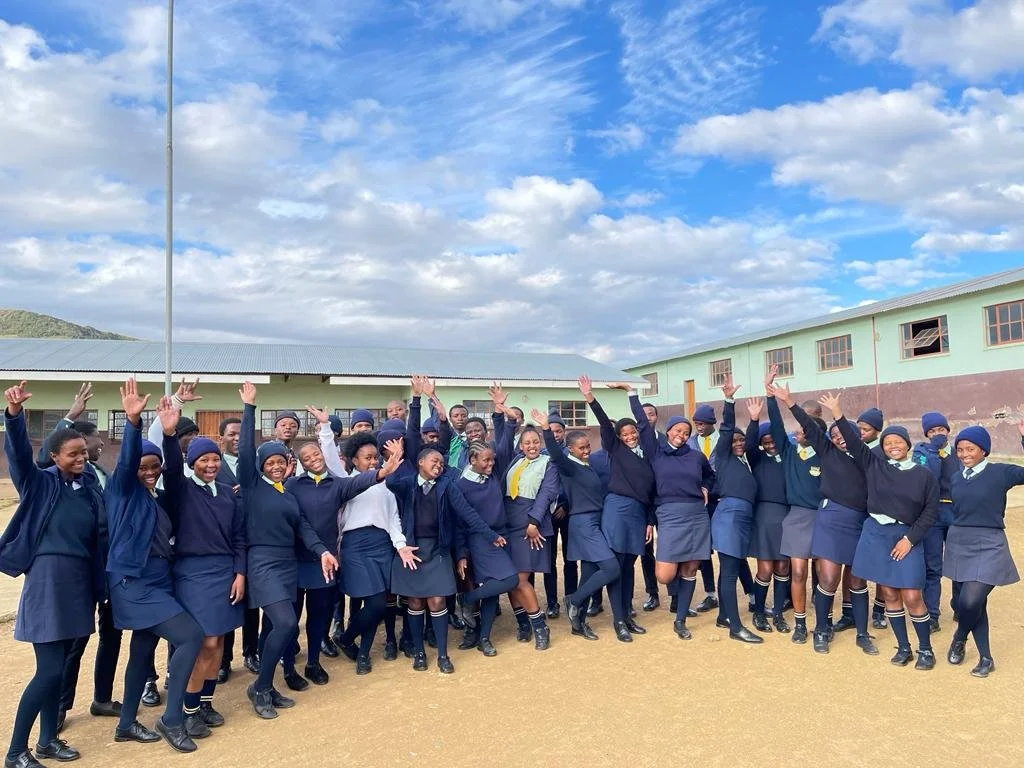 Young people gather for a photo after a university and careers workshop