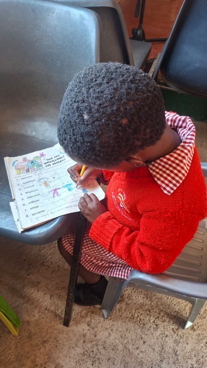 Preschool girl learning her letters