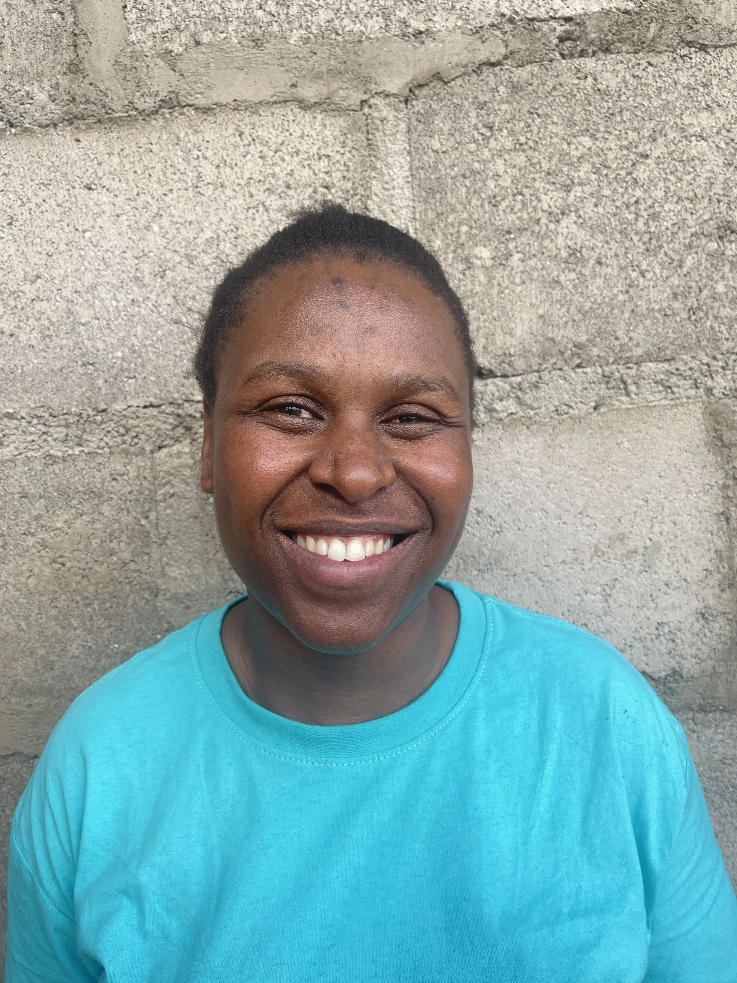 A preschool teacher looking very happy