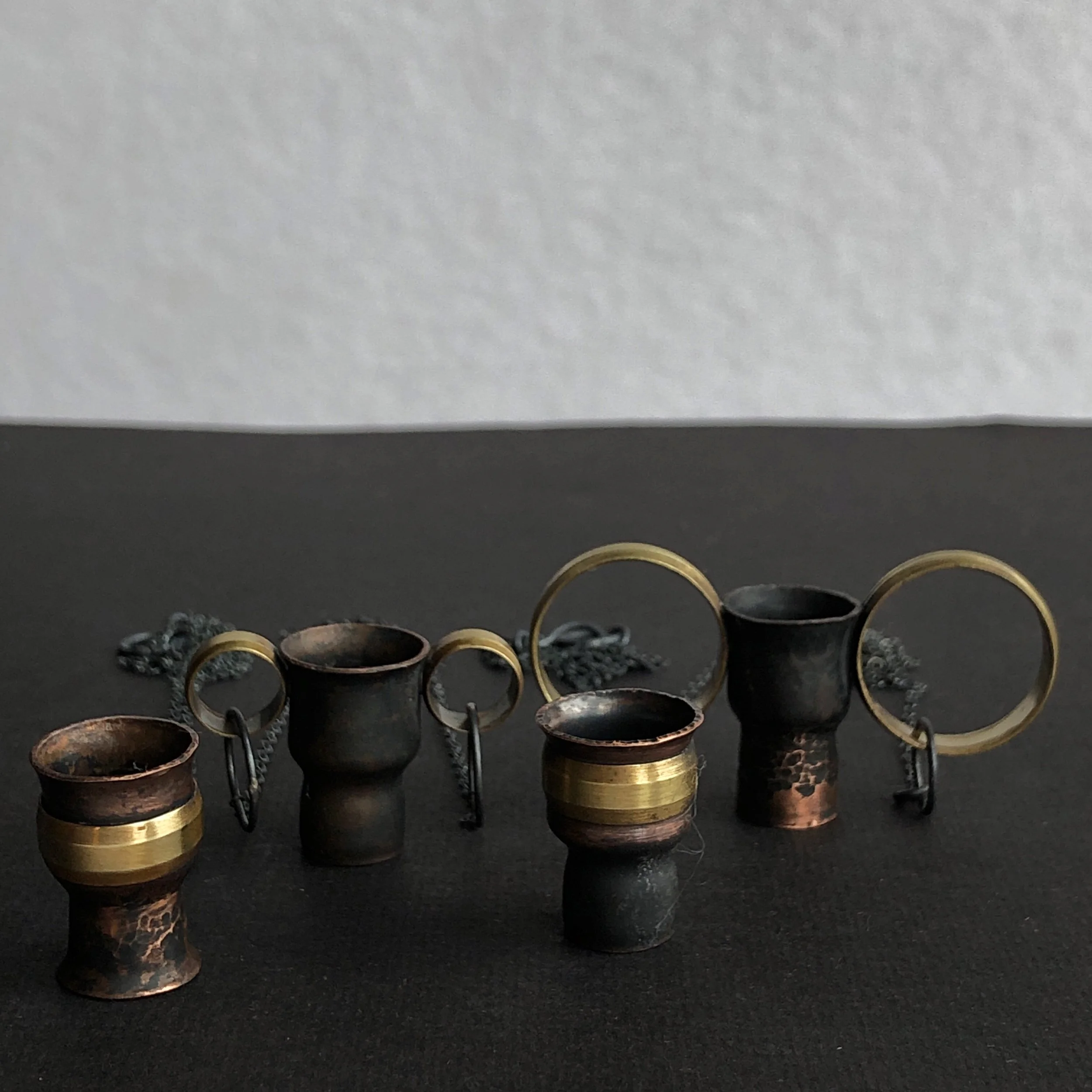 Oxidised copper and brass vessel pendants