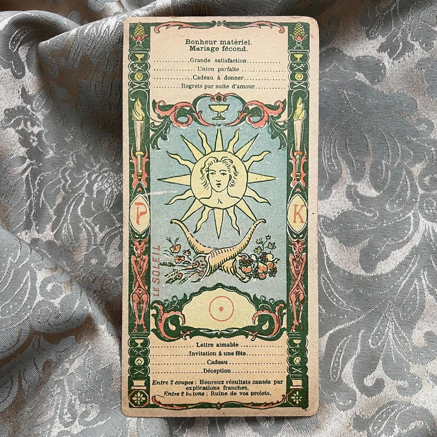 This single card is another Parisian find. It comes from the French Tarot of Madame Dulora De La Haye, its design evocative of the Belle Epoque period the deck was created in. 

Each card in this Major Arcana has a series of key words for upright and