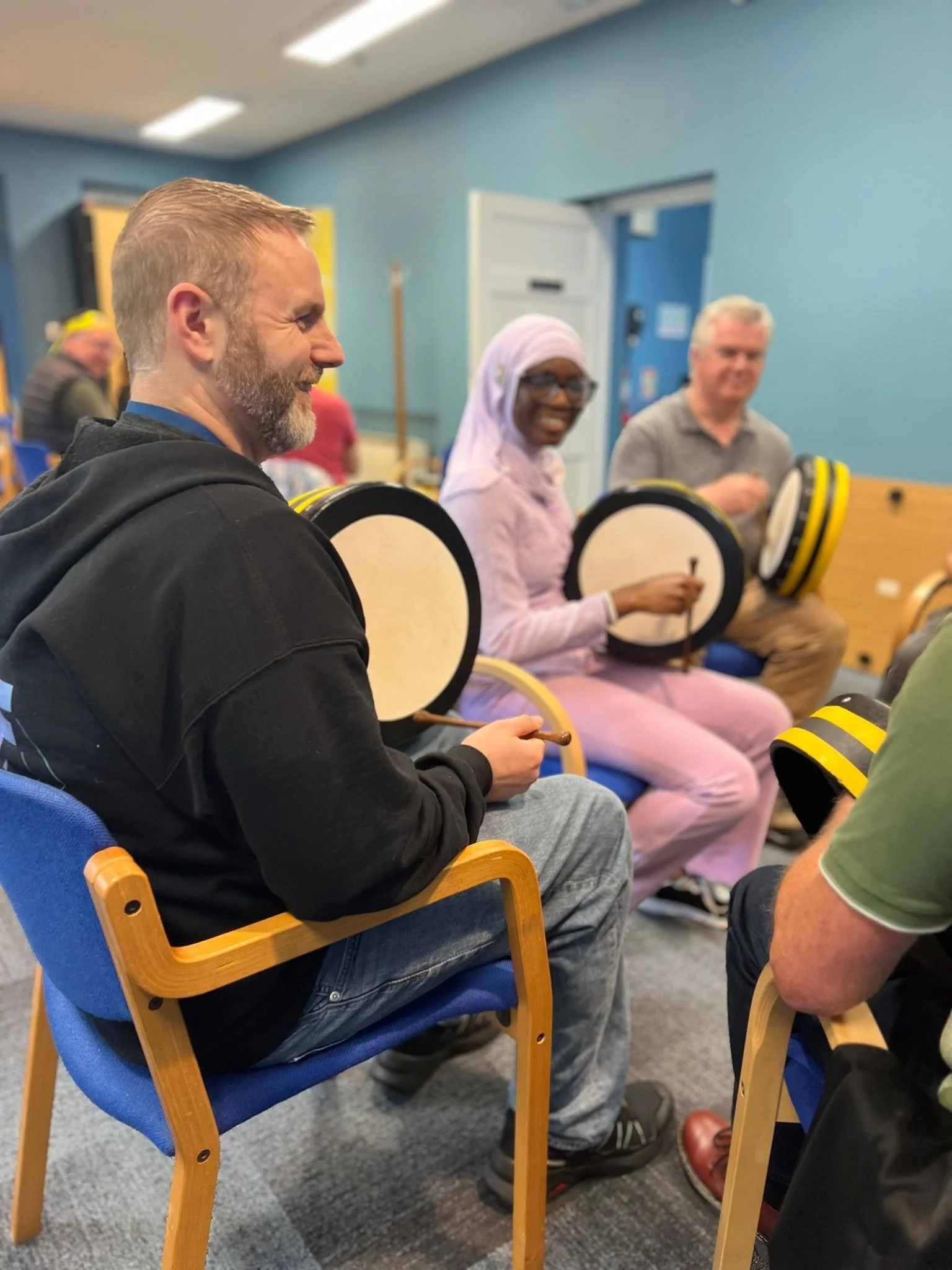 individuals enjoying a bodhran workshop