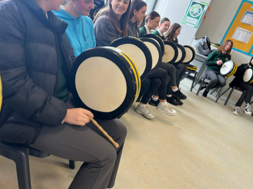 Students holding bodhrans