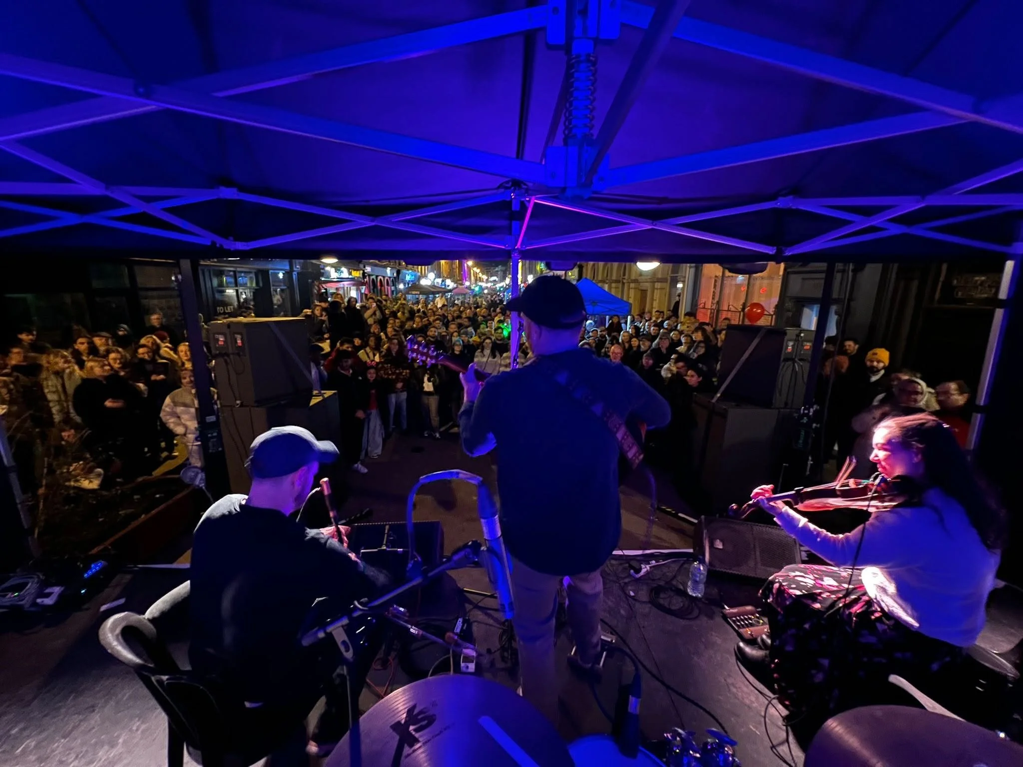A trad band on stage on the streets of dublin
