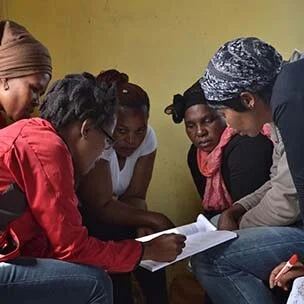 A group of Black women reading together