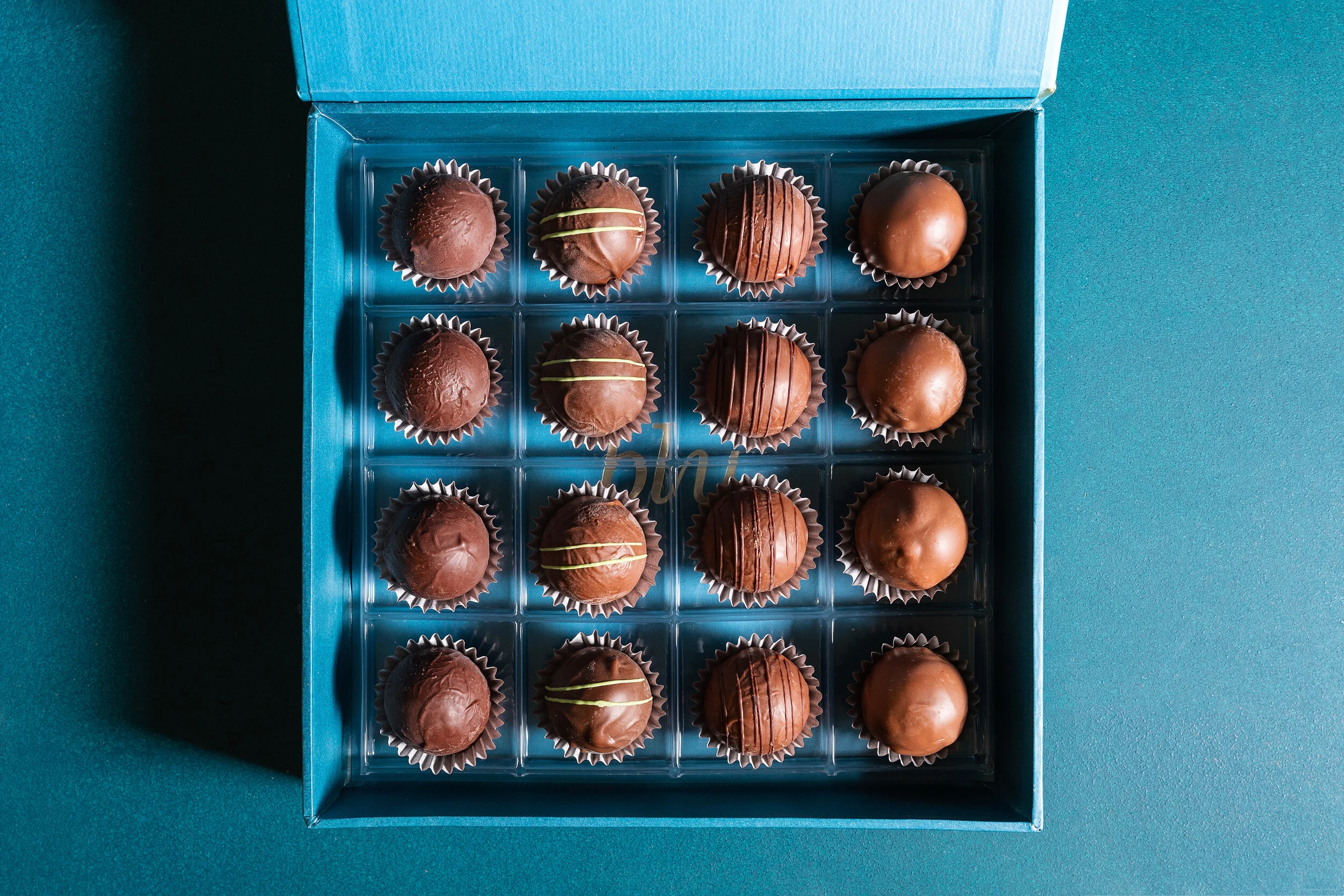 Box of assorted chocolate truffles in a blue box